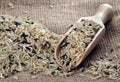 Rice in a wooden scoop  wild brown rice Royalty Free Stock Photo