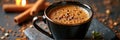 Rich aromatic coffee in black mug with cinnamon sticks and spices Royalty Free Stock Photo