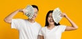 Rich asian couple holding bunch of money