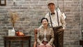 Rich Asian senior couple vintage fashion in luxury house