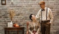 Rich Asian senior couple vintage fashion in luxury house