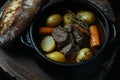 A rich beef stew featuring potatoes, prepared in a crock pot, accompanied by toast on the side Royalty Free Stock Photo