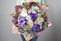 Rich bouquet flowers of different colors mixed in woman hand . Royalty Free Stock Photo