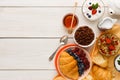 Rich breakfast menu on wooden table, copy space Royalty Free Stock Photo