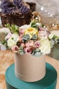 Rich bunch of composition in hatbox. A fresh bouquet flowers different colors mix