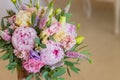 Rich bunch of pink peonies and lilac eustoma roses flowers, green leaf . Fresh spring bouquet. Holodays, gift Royalty Free Stock Photo