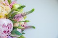 Rich bunch of pink peonies and lilac eustoma roses flowers, green leaf . Fresh spring bouquet. Holodays, gift Royalty Free Stock Photo