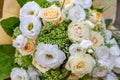 Rich bunch of white and cream rose, Eustoma flowers and green leaf. Bridal vintage bouquet. Floral backdrop