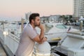Rich businessman dreaming and thinking near the yacht. Portrait of confident man in modern big american city. Stylish Royalty Free Stock Photo
