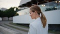 Rich businesswoman walking evening town looking camera with smile close up.