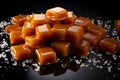 Rich caramels tempt on a dark background, ideal for text