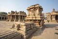 A rich carved stone chariot inside the Vittala Hindu temple in the ancient site Hampi, Karnataka, India Royalty Free Stock Photo