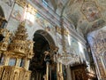 rich church interior, golden interior, paintings on the walls, crystal chandeliers