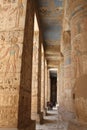Rich and colorful Hieroglyphics and egyptian columns. Ancient symbols of the mortuary temple dedicated to Amun. Luxor, Egypt.