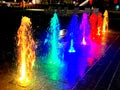 Rich Colorful Water Fountain Jets at Night Royalty Free Stock Photo