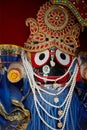 Rich cultural beliefs. Closeup of a richly embroidered and decorated Indian religious icon.