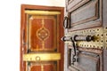 Rich decorated wooden door with lock inside of the Bahia Palace, Marrkesh, Morocco Royalty Free Stock Photo