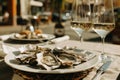 Rich dinner with oysters and wine in Italian restaurant Royalty Free Stock Photo
