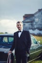 Rich groom at wedding day near car Royalty Free Stock Photo