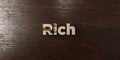 Rich - grungy wooden headline on Maple - 3D rendered royalty free stock image