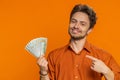 Rich happy man winner waving money dollar cash like a fan, big income wealth success business Royalty Free Stock Photo