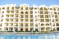 Rich luxury modern residential apartment hotel, tropical resort, swimming pool with blue clear water,green grass lawn on