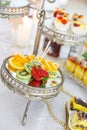 Rich many fresh fruits on luxury wedding table at the reception. Royalty Free Stock Photo