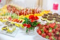 Rich many fresh fruits on luxury wedding table at the reception. Royalty Free Stock Photo