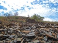 RICH SHALE DEPOSIT IN SOUTH AFRICA WITH BLUE SKY AND WHITE CLOUDS Royalty Free Stock Photo
