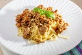 Rich spicy Italian spaghetti Bolognaise with parmesan cheese and a fresh green basil leaves viewed from overhead on a Royalty Free Stock Photo