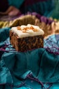 Rich sweet Christmas puddings loaded with dry fruits, nuts and spices on vibrant eastern background Royalty Free Stock Photo