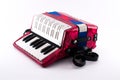 Richly colored small accordion toy Royalty Free Stock Photo