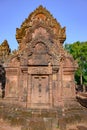 Richly decorated entrance door of Temple Banteay Srei, Cambodia. Carvings from Hindu mythology on walls Banteay Srei, Angkor Wat.