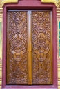 Richly decorated vintage wooden window in the wall