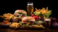Richly set table with hamburgers, beer, fries, chicken nuggets, salads on a dark background Royalty Free Stock Photo
