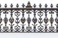 richly textured wrought iron fence detail on white background Royalty Free Stock Photo