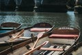 Richmond Bridge Boat Hire wooden boats moored on the River Thames, London, UK.