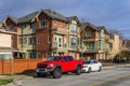 RICHMOND, CANADA - MARCH 31, 2020: cars in front of modern appartment houses family homes in the canadian city