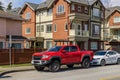 RICHMOND, CANADA - MARCH 31, 2020: cars in front of modern appartment houses family homes in the canadian city