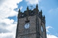 A view of the Green Howards Museum in Richmond market place against a bright blue cloudy sky