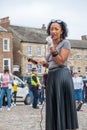 A black woman presents at a Black Lives Matter protest in Richmond, North Yorkshire