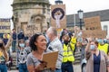 A black woman presents at a Black Lives Matter protest in Richmond, North Yorkshire, with supporters in the background