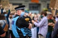 A Police Liaison Officer wears a PPE Face Mask at a Black Lives Matter protest