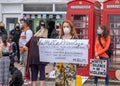 A young girl wearing a face mask holds a banner about white privilege at a Black Lives Matter protest in Richmond, North Yorkshire