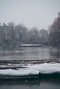 Boats covered in snow and moored on the river in West part of the city