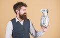 Richness and wellbeing. Security and cash money savings. Banking concept. General savings tips. Man bearded hipster hold Royalty Free Stock Photo