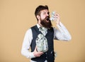 Richness and wellbeing. Security and cash money savings. Banking concept. Man bearded guy hold jar full of cash savings Royalty Free Stock Photo