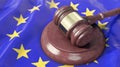 Judge`s gavel lies on top of the EU flag Royalty Free Stock Photo