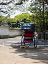 Rickshaw cart at the entrance to historic Marugame castle Royalty Free Stock Photo