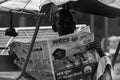 Rickshaw driver reading Newspaper black and white photo